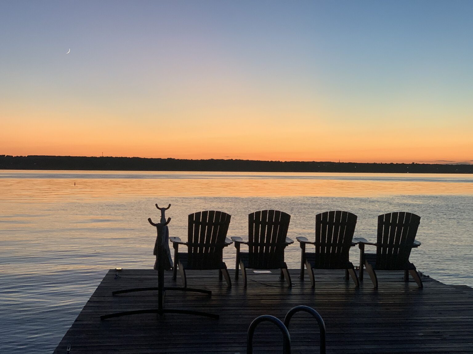 adirondack chairs dock sunset