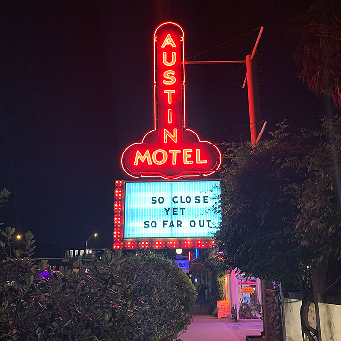 austin motel sign at night phallic
