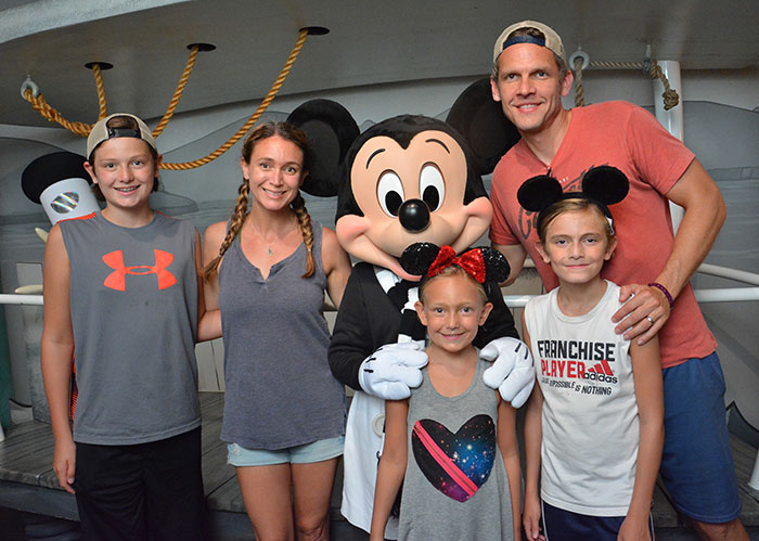 Family with Mickey in Disneyland