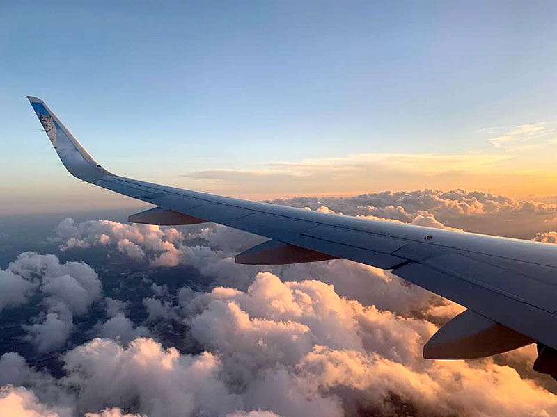 frontier plane wing clouds