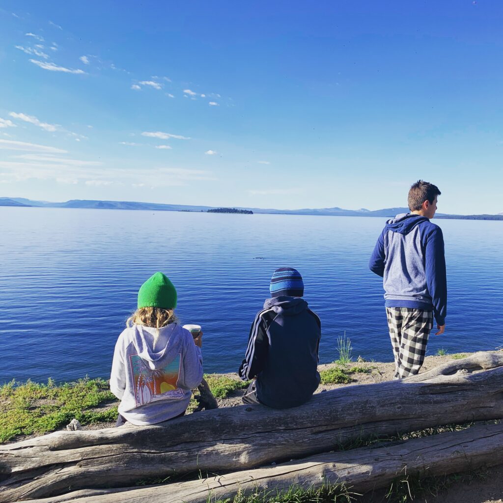 kids sitting by grand tetons