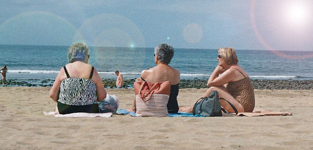 older women on beach sun